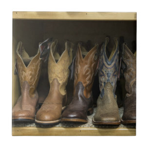 Western Cowboy Boots On Shelf Tile