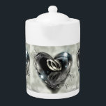 What God Has Put Together Wedding Rings Teapot<br><div class="desc">Beauiful porcelain teapot that can make a great wedding shower gift. Matching latte mugs are available. The teapot has a printed image of an acrylic painting of silver wedding rings inside a crystal heart shaped bubble.</div>