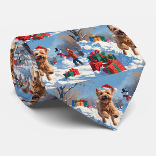 Wheaten Terrier Running in Snow with Christmas Hat Tie