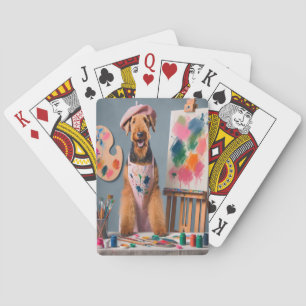 Whimsical Airedale Terrier Working as an Artist Playing Cards