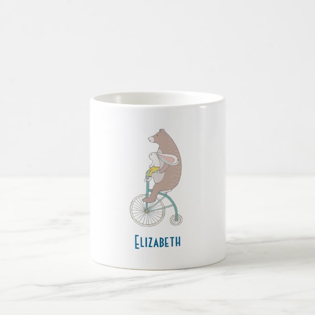 Whimsical Bunny and Bear Riding a Bike Together Coffee Mug (Center)