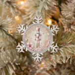 Whimsical Elegant Pink & Gold Pastel Nutcracker Snowflake Pewter Christmas Ornament<br><div class="desc">Add a sprinkle of sugarplum charm to your tree with this enchanting Whimsical Elegant Pink and Gold Pastel Nutcracker snowflake ornament. The design features a beautifully illustrated nutcracker surrounded by blush pink tones, shimmering gold accents, dainty bows, holly sprigs, ornaments, and delicate winter florals — all created in dreamy pastel...</div>