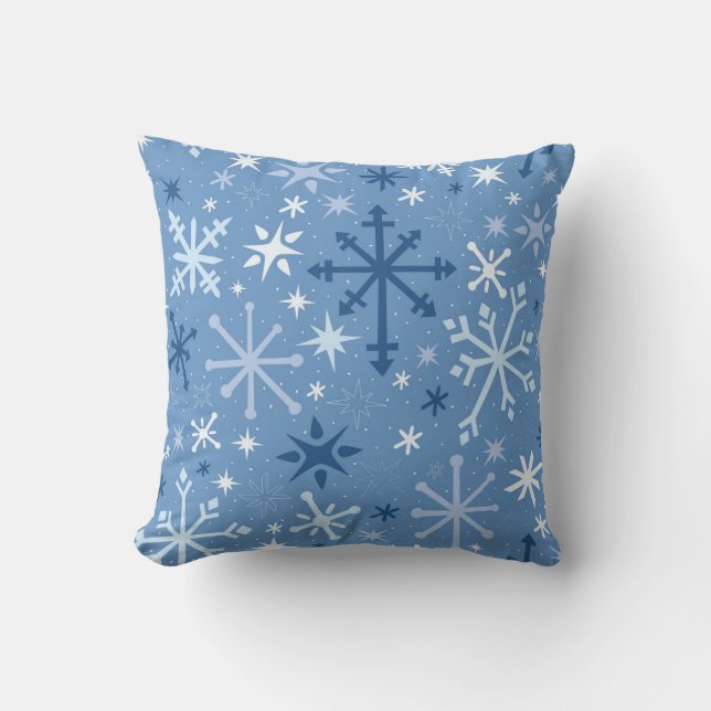 Whimsical flurry of blue snowflakes on sky blue cushion (Front)