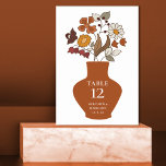 Whimsical Retro Boho Floral Wedding Table Number<br><div class="desc">Whimsical Retro Boho Floral Personalised Wedding Table Number Card... A whimsical floral bouquet in a retro bohemian style sits in a terracotta vase overlaid with your wedding table number info in elegant serif typography followed by the bride and groom names and wedding date. All text can be easily revised on...</div>