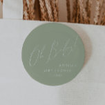 Whimsical Sage Green Oh Baby 6 Cm Round Badge<br><div class="desc">Introducing our whimsical sage green oh baby button, perfect for your simple modern boho celebration any season of the year! This button has a boho-chic, gender-neutral vibe with elegant calligraphy and a delicate minimalist design, making it ideal for both girls and boys. Plus, it's editable, so you can add your...</div>