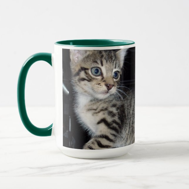 "Whiskers of Trouble: The Mischievous Tabby Kitten Mug (Left)