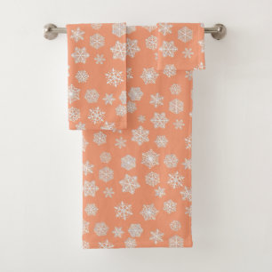 White 3-d snowflakes on a peach background bath towel set