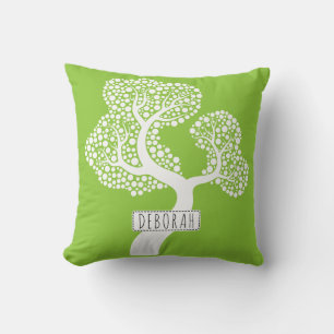 White abstract circle tree and name on lime green cushion