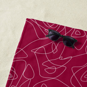 White abstract doodles on dark red background beach towel