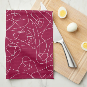 White abstract doodles on dark red background tea towel