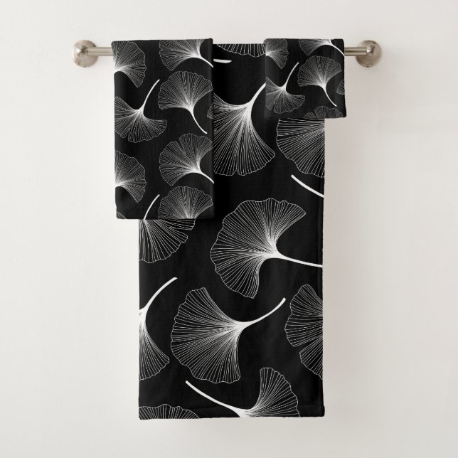 White abstract leaves pattern on black background bath towel set (Insitu)