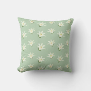 White Amaryllis Flowers on Light Green Cushion