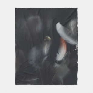 WHITE AND BLACK FEATHER ON BLACK BACKGROUND FLEECE BLANKET