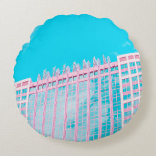 WHITE AND BLUE CONCRETE BUILDING UNDER BLUE SKY ROUND CUSHION