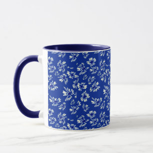 white and blue floral pattern mug
