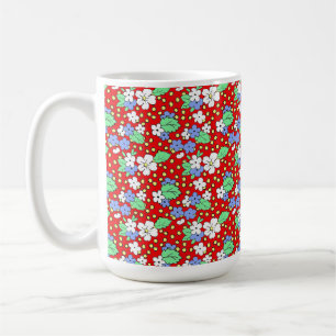 White and blue flowers on red coffee mug