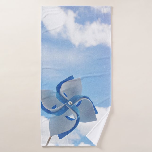 White and blue handheld windmill under cloudy skie bath towel (Bath Towel)