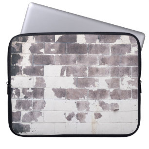 White and brown concrete wall laptop sleeve
