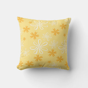white and brown floral pattern cushion