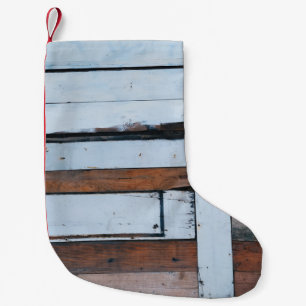 White and brown wooden board small christmas stocking