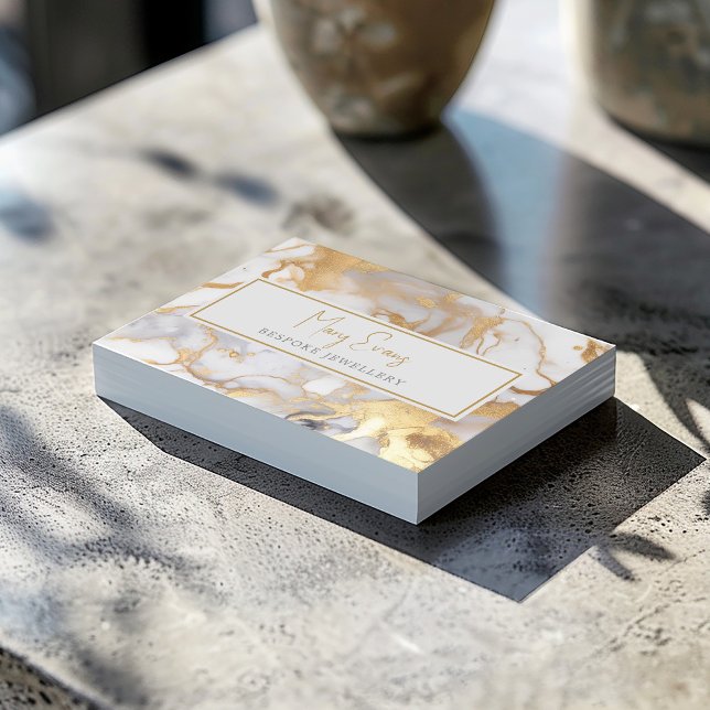 White and gold marble effect business card (This unique card features a luxury white and gold pattern.)