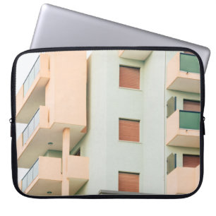 WHITE AND PINK CONCRETE BUILDING LAPTOP SLEEVE