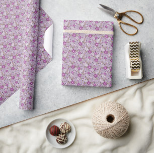 White and purple flowers on a pale lilac backgroun wrapping paper