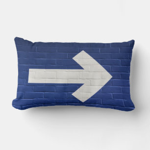 White arrow painted on brick wall lumbar cushion