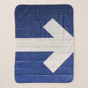 White arrow painted on brick wall sherpa blanket
