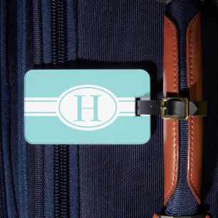 White band oval shield light blue monogram luggage tag
