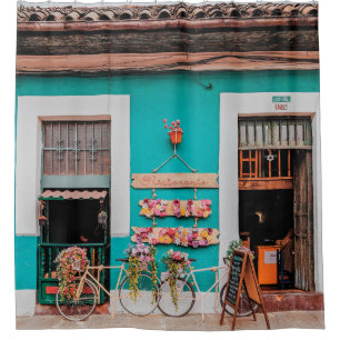 WHITE BICYCLE PARKED BESIDE TEAL PAINTED CONCRETE  SHOWER CURTAIN