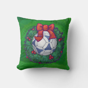 White, Blue Festive Soccer Ball on Green Cushion