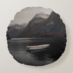 WHITE BOAT ON BODY OF WATER NEAR MOUNTAINS ROUND CUSHION