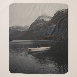 WHITE BOAT ON BODY OF WATER NEAR MOUNTAINS SHERPA BLANKET