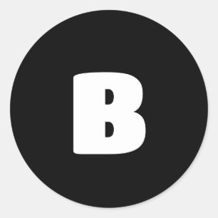 White bold initial on black classic round sticker