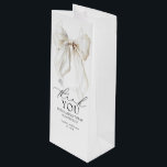 White Bow Bridal Shower Thank You Favours Wine Gift Bag<br><div class="desc">Add a Romantic Touch with These Elegant White Bow Thank You Wine Gift Bags. Thoughtfully designed with a graceful white satin bow and a heartfelt message — “Thank you” and “For making today so special” — these wine gift bags offer a timeless way to show appreciation. Whether you're gifting a...</div>