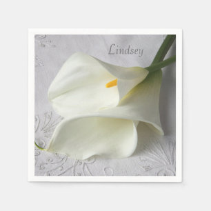 White calla lilies on linen napkin