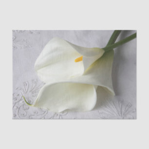 White calla lilies on linen tissue paper