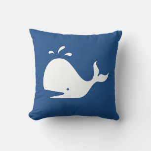 white CARTOON whale on medium blue pillow