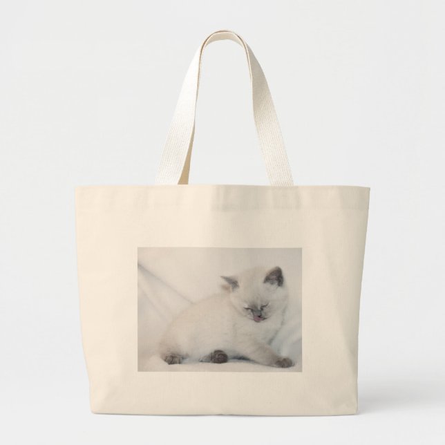 White cat grooming itself large tote bag (Front)