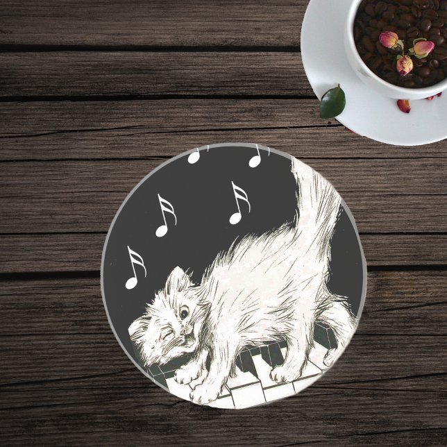 White Cat on Piano Keys Coaster (White winking cat on piano keys on black with white music notes glass drink coaster.)