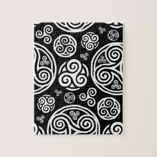 White celtic triskels on black jigsaw puzzle