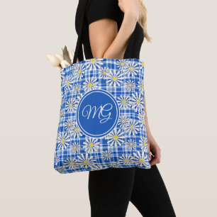 White chamomile flowers on a blue chequered backgr tote bag