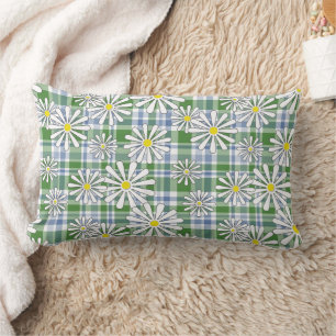 White chamomile flowers on a green blue chequered  lumbar cushion