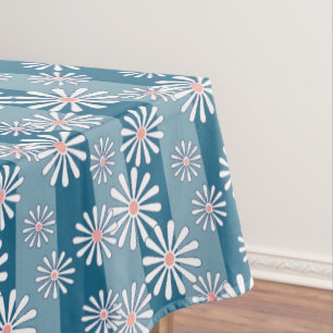 White chamomile flowers on striped blue background tablecloth