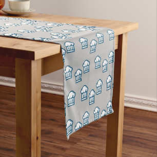 White chef hats on grey medium table runner