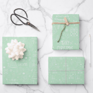 White Christmas Outlines on Light Green Wrapping Paper Sheet