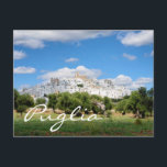 White city and olive trees in Puglia text postcard<br><div class="desc">Postcard of a landscape in Puglia,  Italy,  with the white city (citta bianca) Ostuni on a hill above an olive tree orchard under a cloudy sky with the text: 'Puglia'.</div>