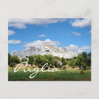 White city and olive trees in Puglia text postcard