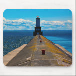 White City Lighthouse Mouse Pad<br><div class="desc">A long breakwater stretches across the water towards a distant lighthouse,  drawing the eye along its weathered surface. The contrast between textured concrete,  open water,  and sky creates a strong sense of direction and depth.</div>